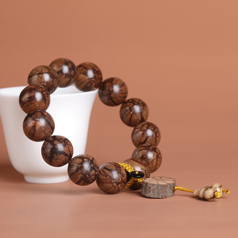 15mm Plum Blossom Wood Inner Peace Bracelet