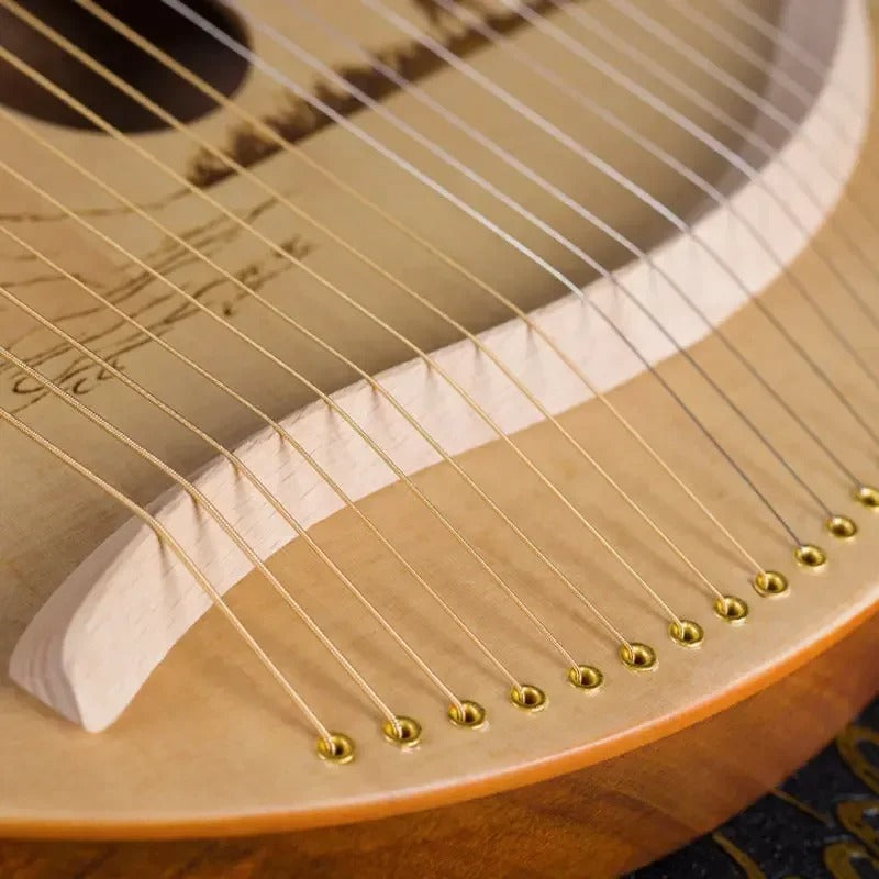 Close-up view of harp strings and bridge on 19-String Wood Lyre Harp for Beginners