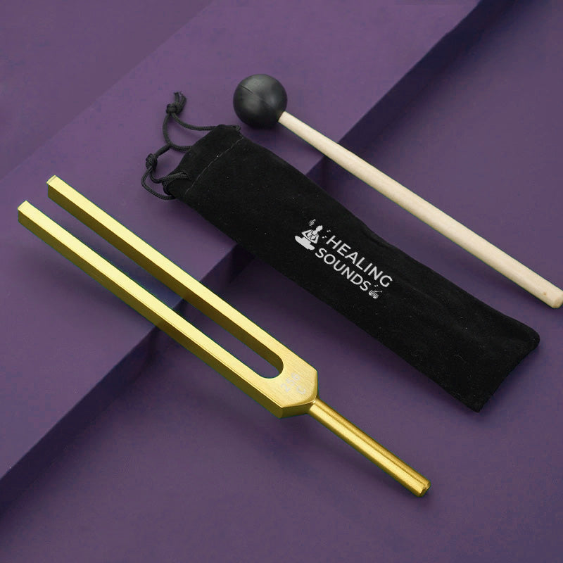 Gold-colored Uranus Tuning Fork 207.36 Hz with black storage pouch for sound healing