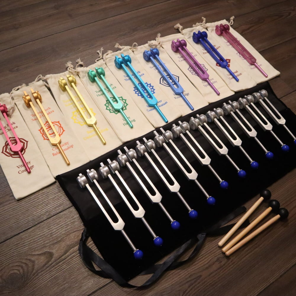 Colorful tuning forks on fabric in 20pc Solfeggio & Planetary Tuning Fork Set