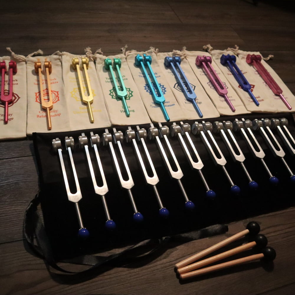 Colorful tuning forks in a rainbow pattern from 20pc Solfeggio & Planetary Tuning Fork Set