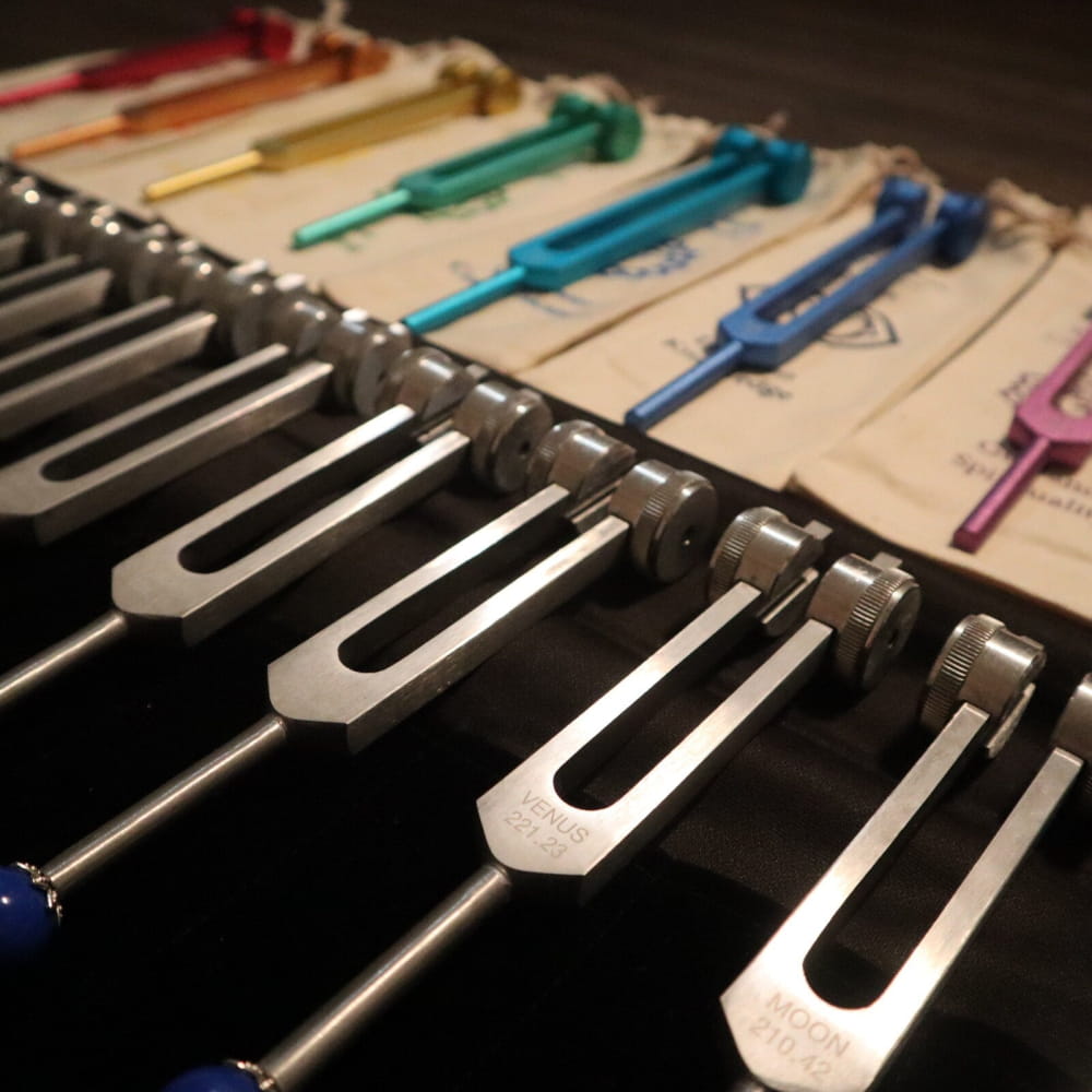 Collection of colorful tuning forks for the 20pc Solfeggio & Planetary Tuning Fork Set