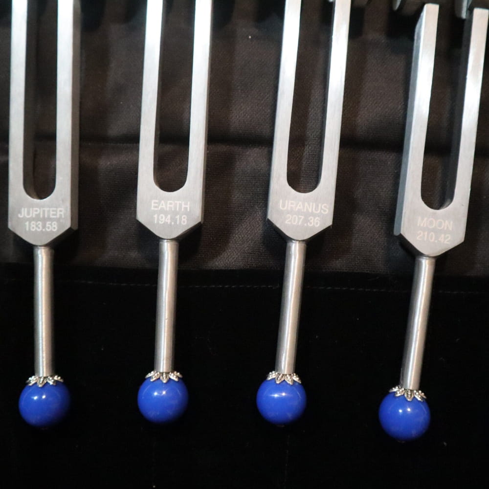 Four blue-ended tuning forks from the 20pc Solfeggio & Planetary Tuning Fork Set