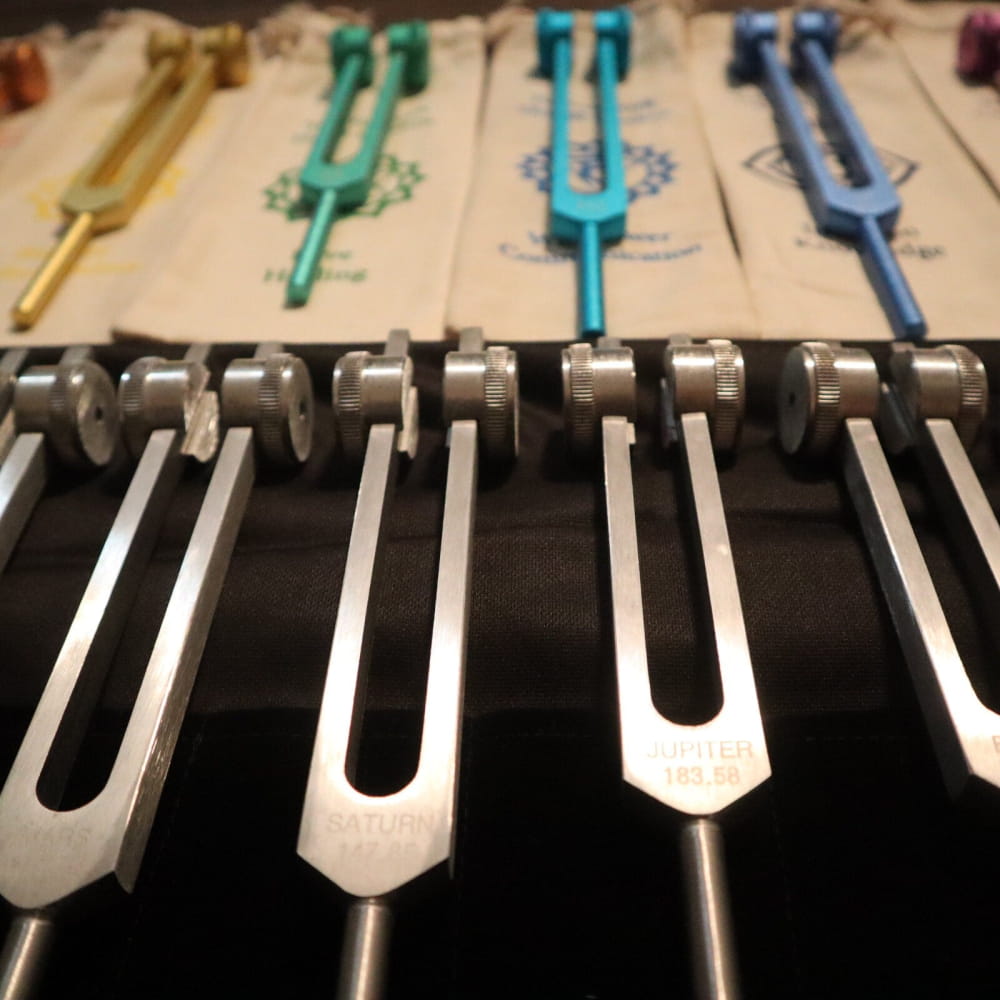 Colorful Medical Tuning Forks in a Row for Solfeggio & Planetary Healing Set