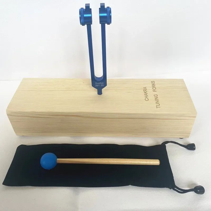 Tuning fork with wooden base and mallet for Third Eye Chakra Healing at 221.23 Hz