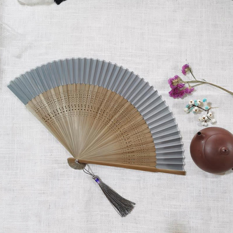 22cm Bamboo Folding Fan with Hollow Engraved Design | Tranquil Comfort
