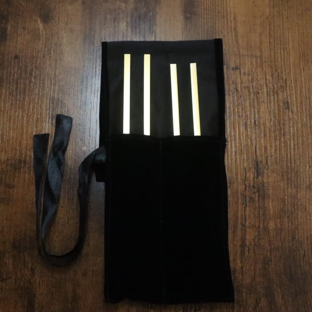 Black fabric holder with glowing stripes for 256 Hz and 384 Hz Tuning Forks