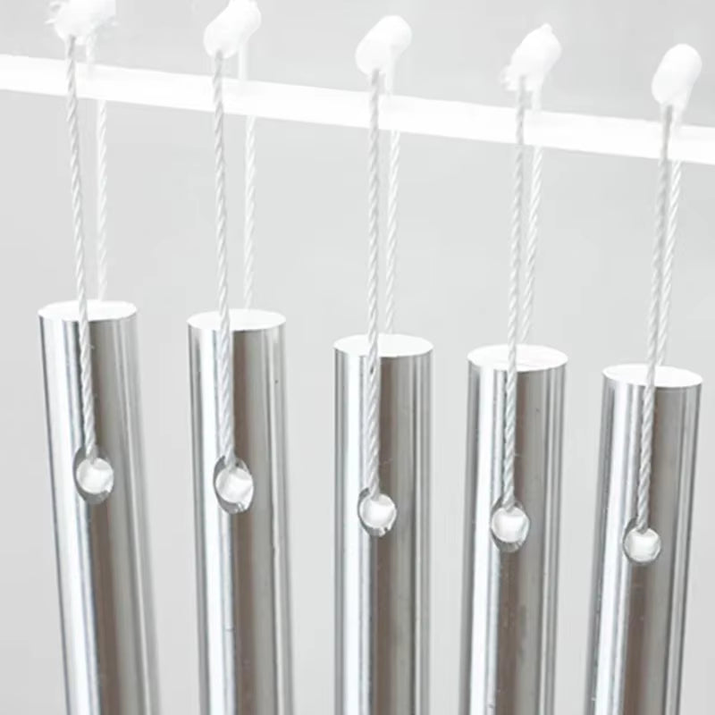 Five metallic tubes with candles in 27 Notes Equilibrium Swing Chimes design