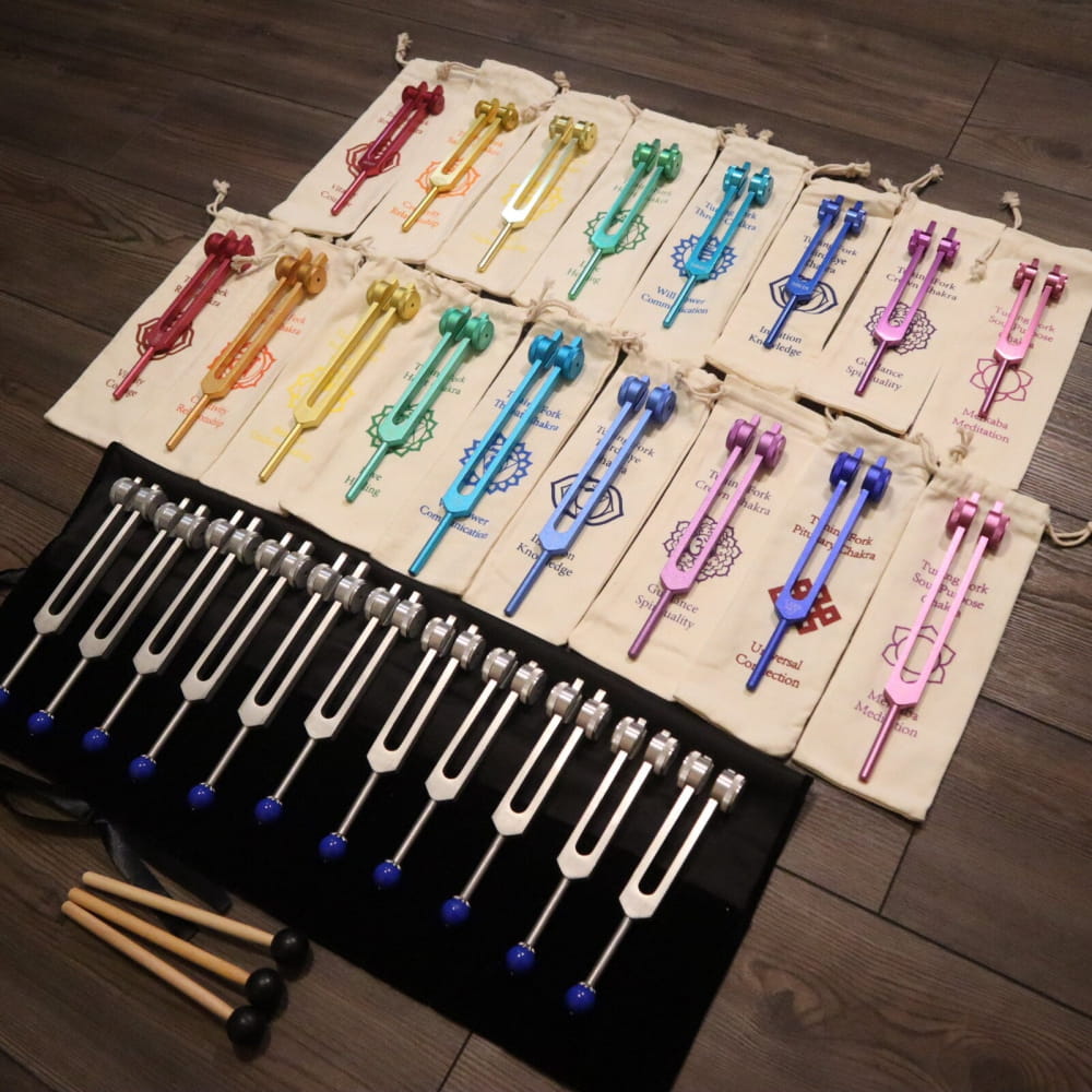 Colorful tuning forks in rainbow pattern from 28pc Solfeggio & Planetary Tuning Fork Set