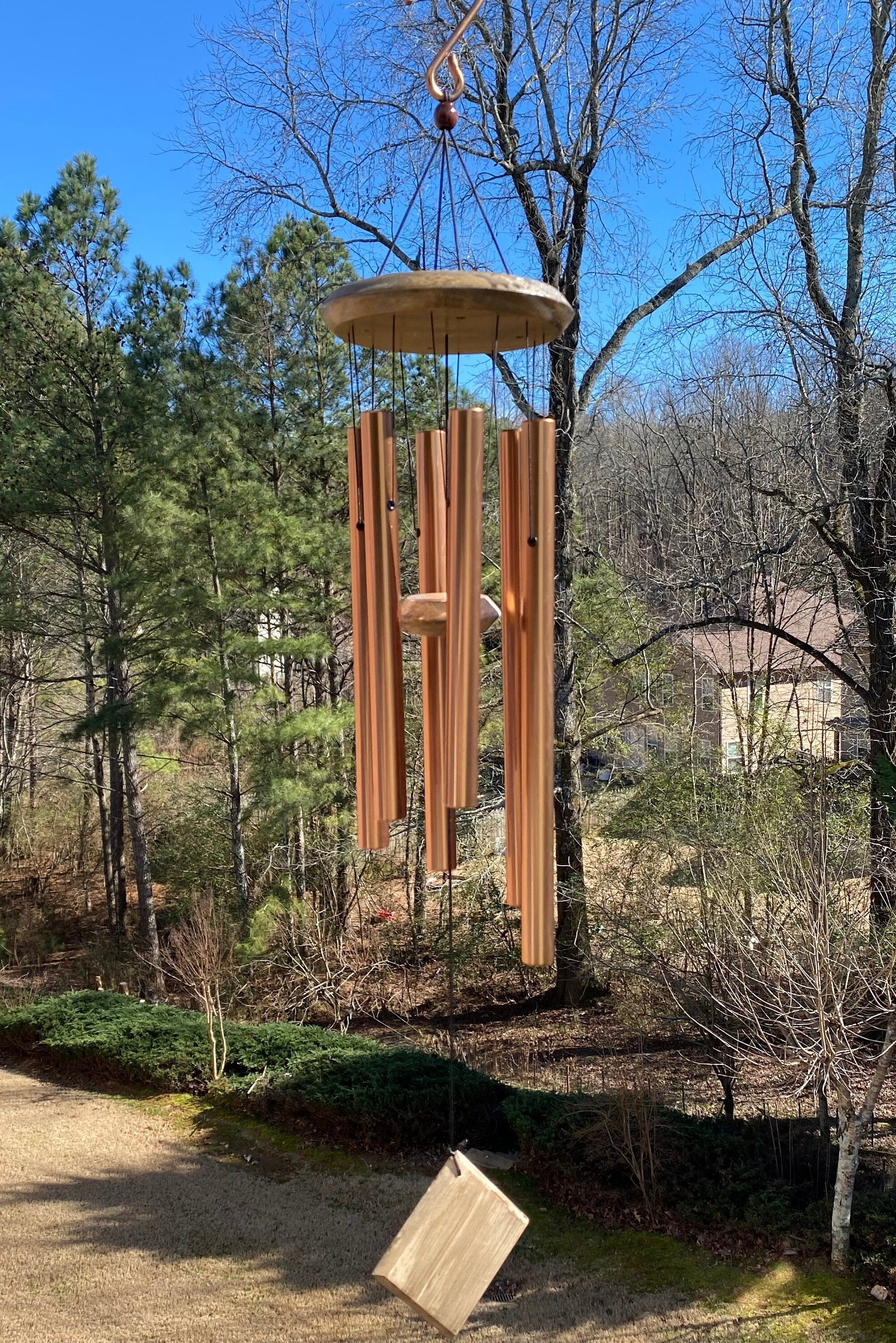 Wooden wind chime with long tubular bells and circular top in Deep Tone Golden Metal design