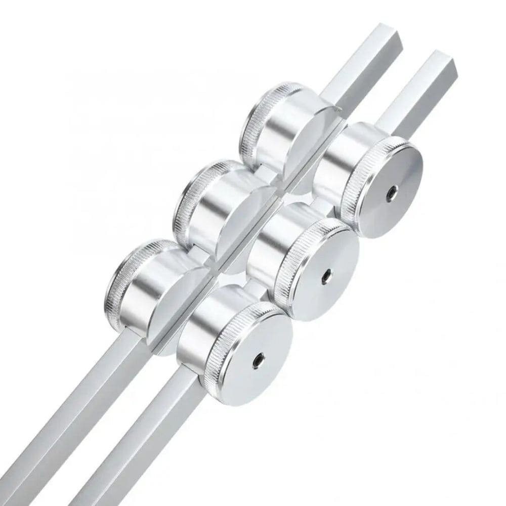 Metal rollers on aluminum rails in 32 Hz Tuning Fork for Deep Relaxation Therapy