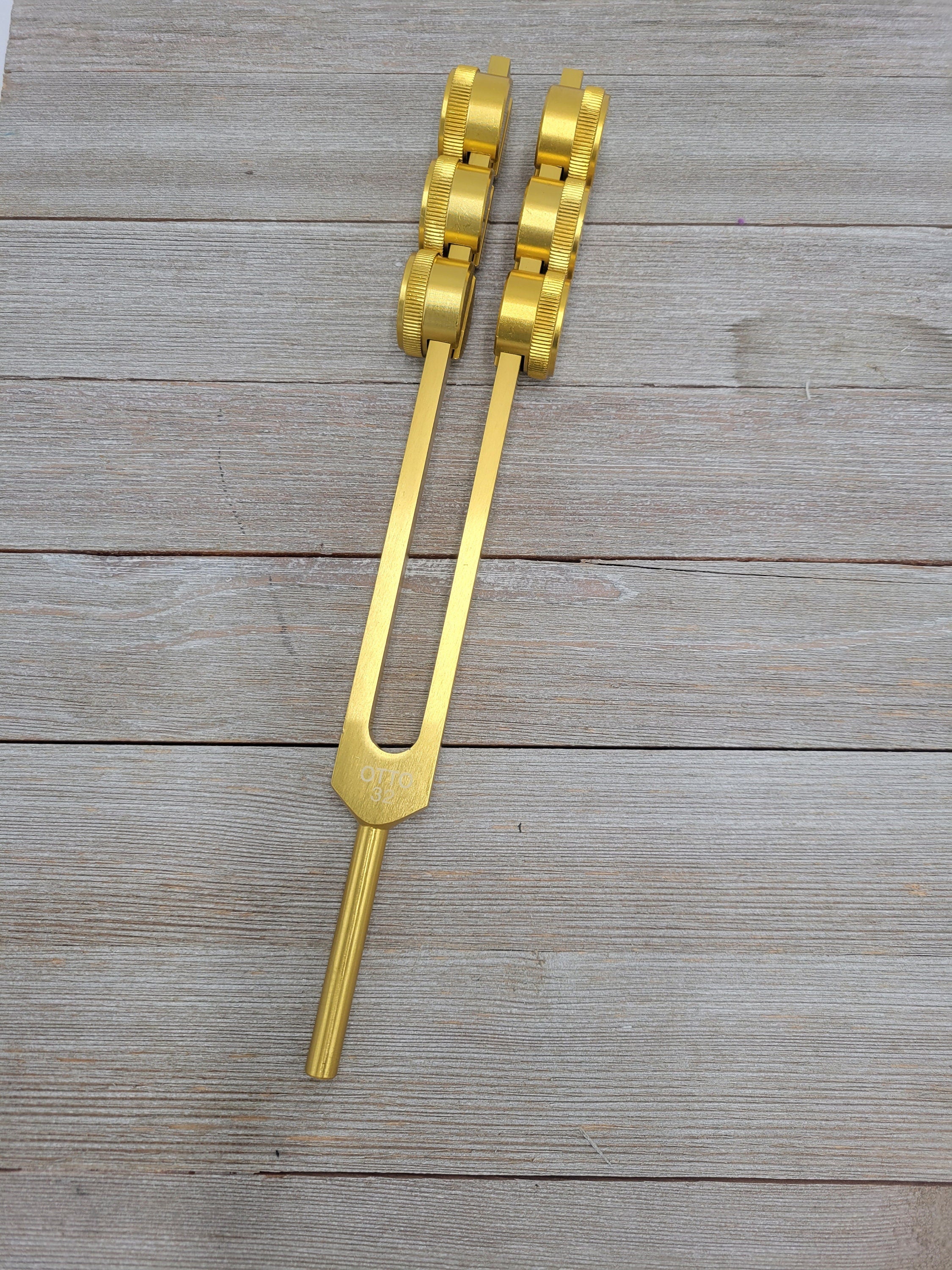 Golden dual-pronged tuning fork for healing, 32 Hz, Gold Weighted Otto