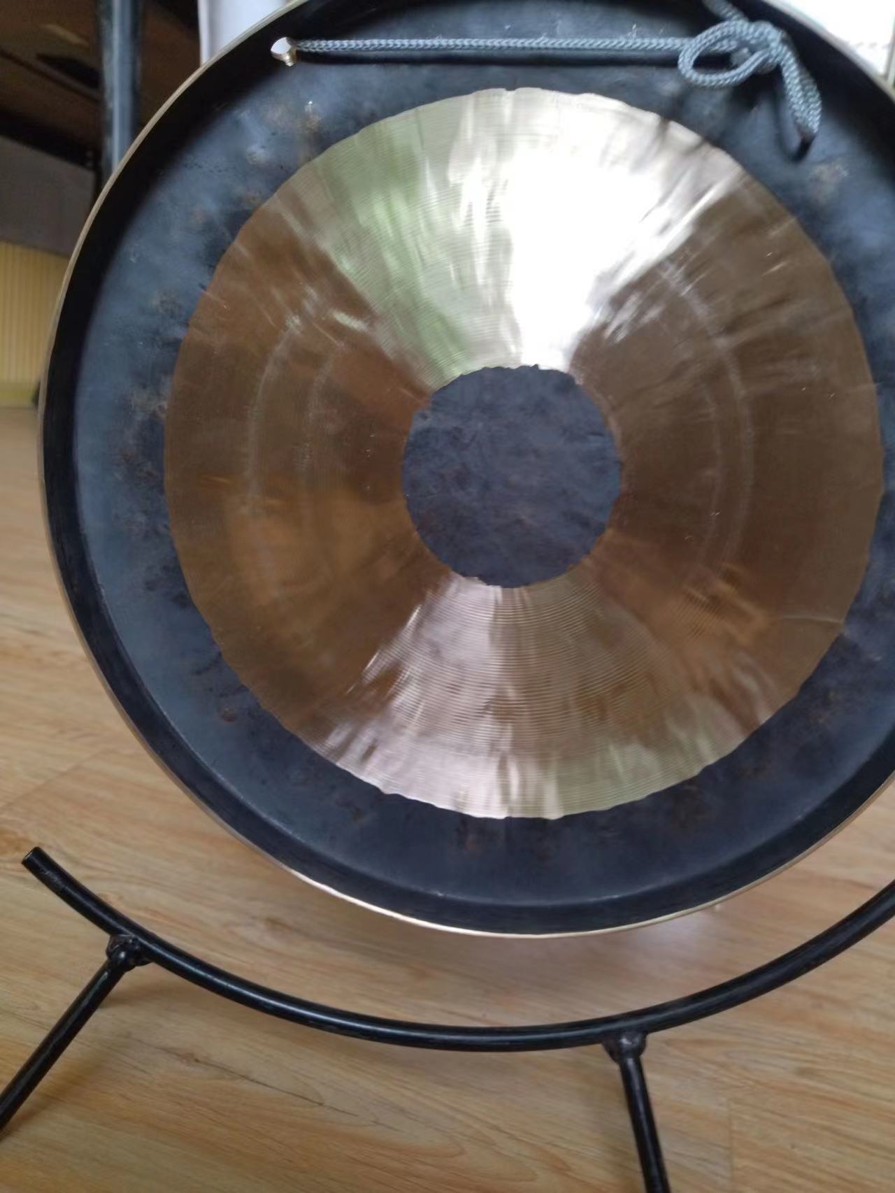 Metallic 32 Inch Copper Gong on a sleek black stand for meditation sound therapy