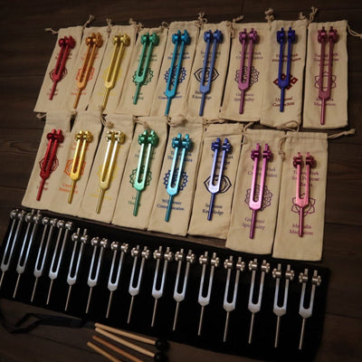 Colorful tuning forks on display board from 34pc Solfeggio & Chakra Tuning Fork Set