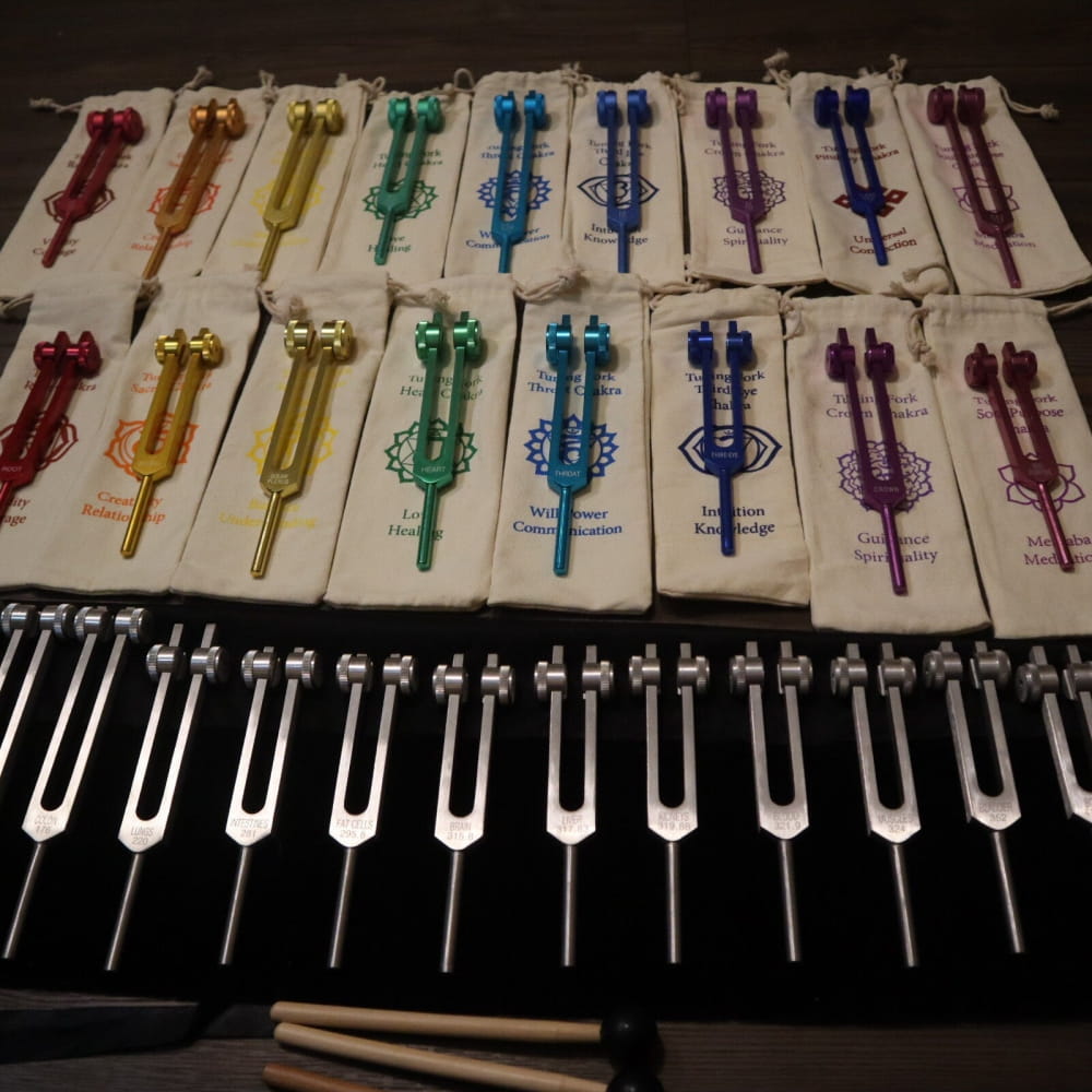 Colorful tuning forks in chromatic scale pattern from 34pc Solfeggio & Chakra Set