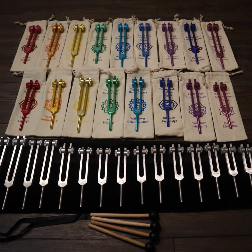 Colorful tuning forks in rainbow pattern from 34pc Solfeggio & Chakra Tuning Fork Set