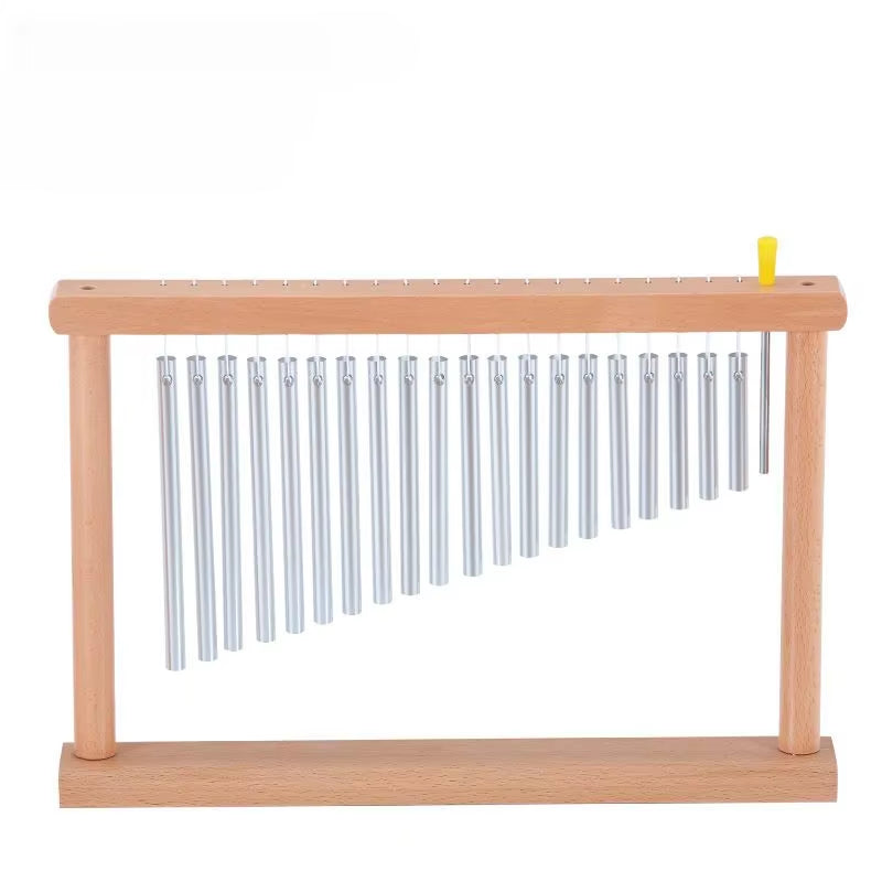 Metal chimes on wooden frame with graduated lengths for yoga and meditation purposes