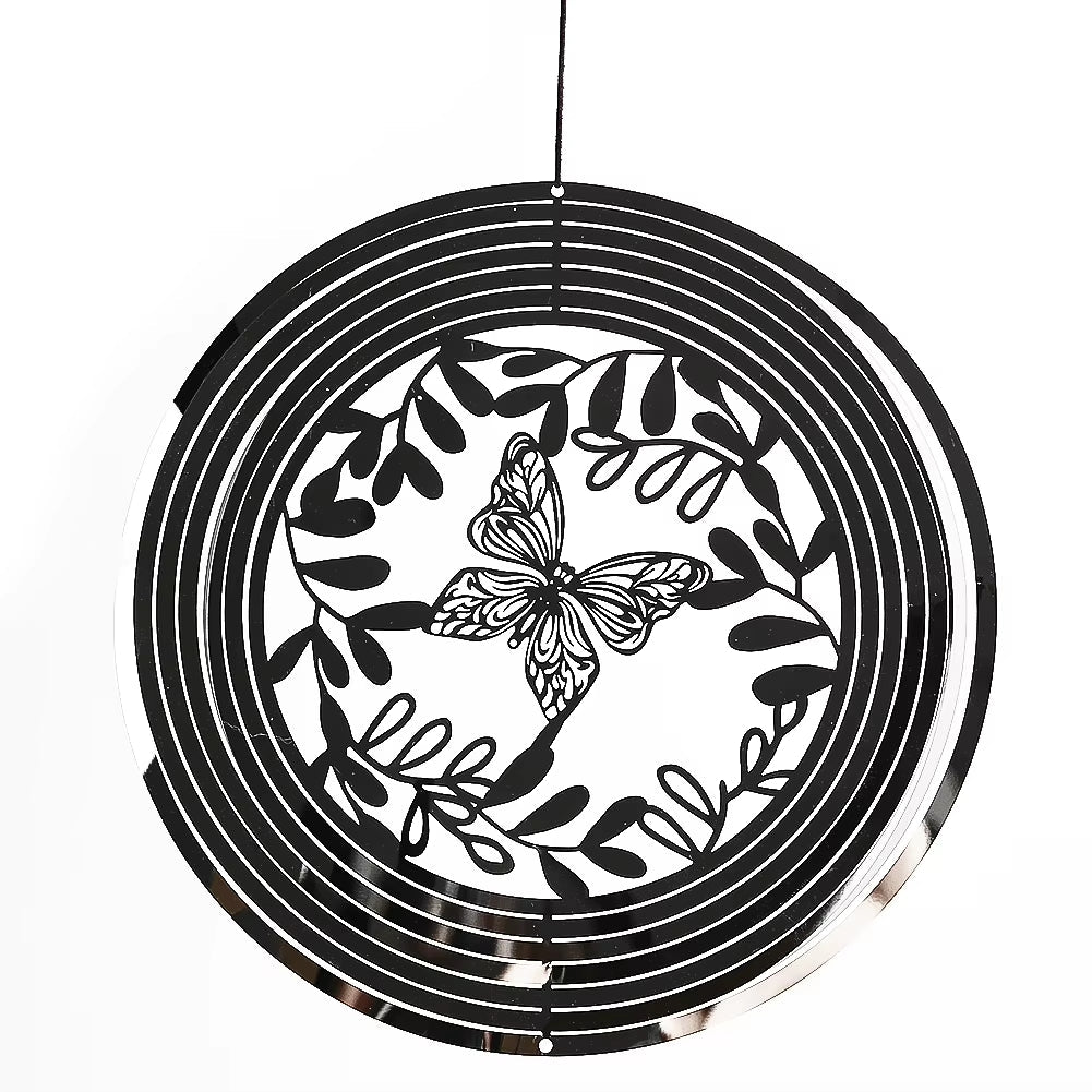 Black and white circular wind spinner with butterfly and leaf design for outdoor decor