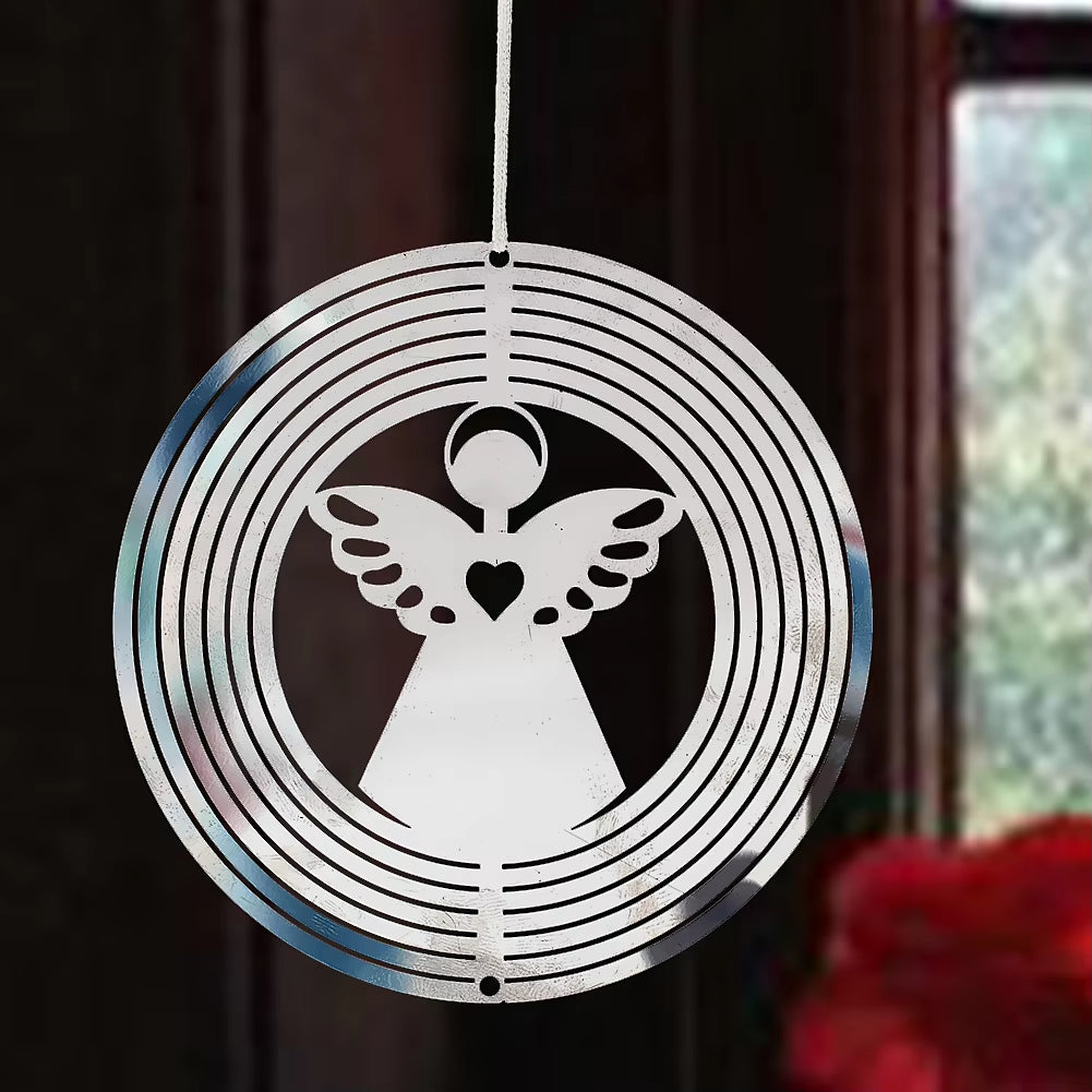 White metal wind spinner with angel design and concentric circles for garden decor