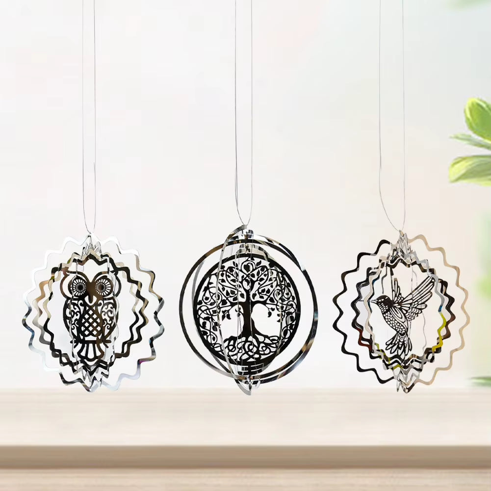 Three decorative hanging ornaments with owl, tree of life, and rooster designs