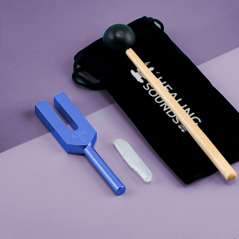 Blue 4096 Hz Tuning Fork with Crystal and black pouch and accessories displayed