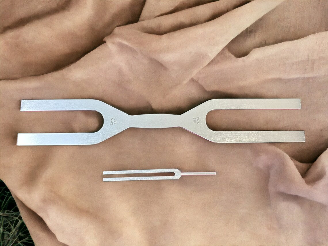 Metallic tuning fork set featuring 432 Hz and 288 Hz for DNA healing