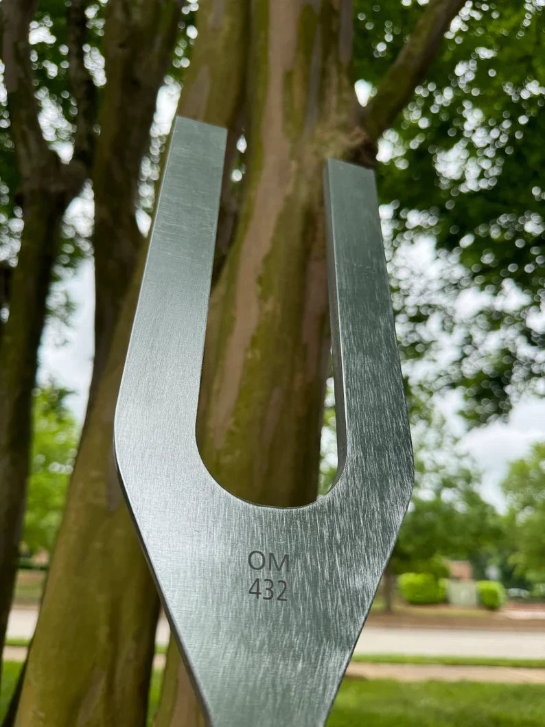 Metal tuning fork with engraved markings for 432 Hz and 528 Hz frequency healing