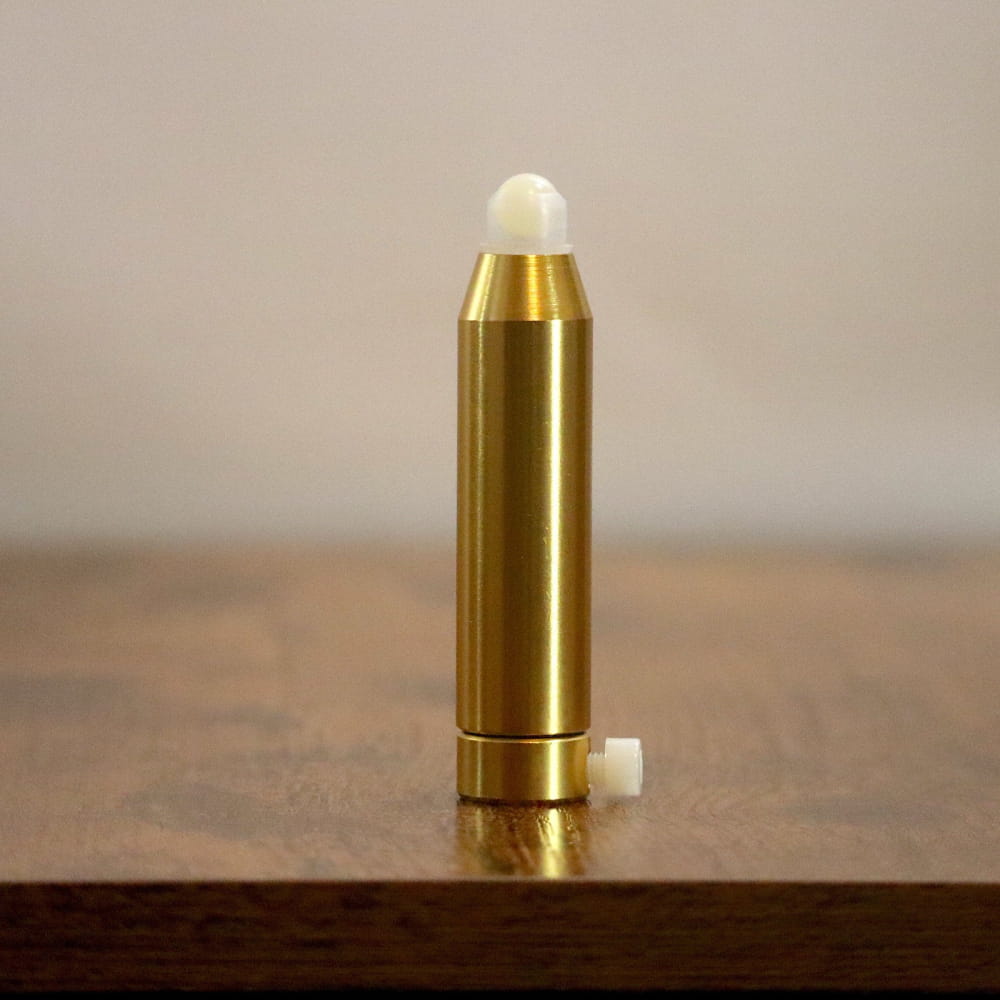 Gold bullet-shaped container with white tip for 432 Hz Weighted Tuning Fork