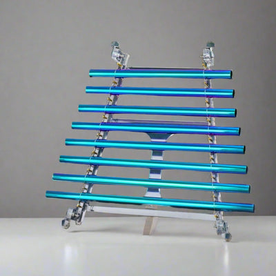 Turquoise and blue neon light tubes on a crystal singing harp with an alumina box