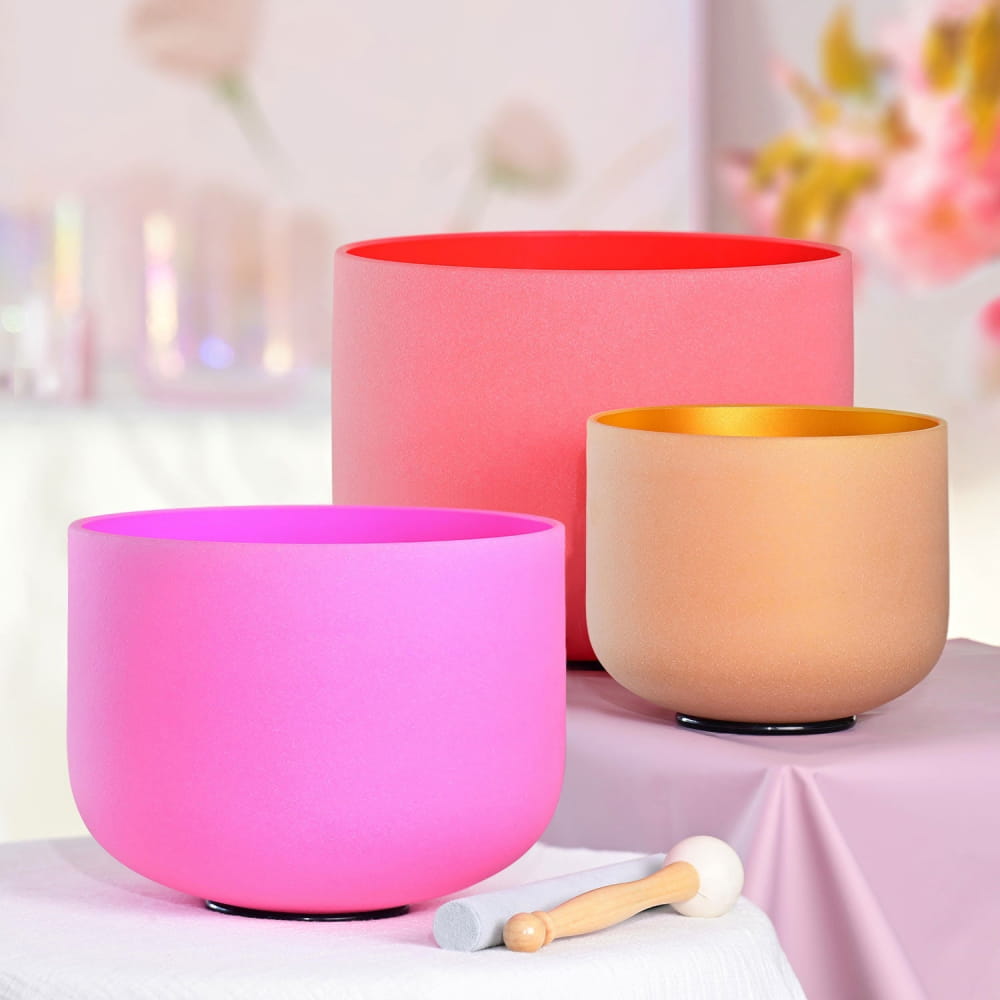 Three colorful crystal singing bowls in pink, red, and beige tones from 432Hz Spring Limit set