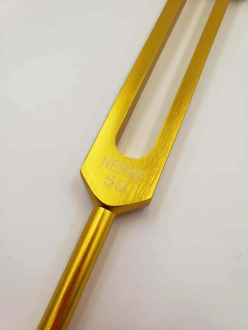 Golden metallic tuning fork for 50 Hz nerve healing therapy and sound healing