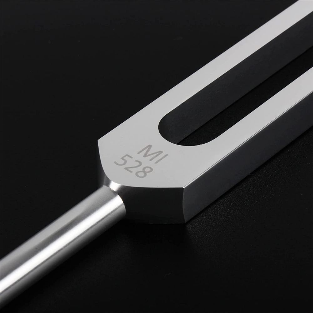 Metal tuning fork with MI 528 engraved for healing in resonance box