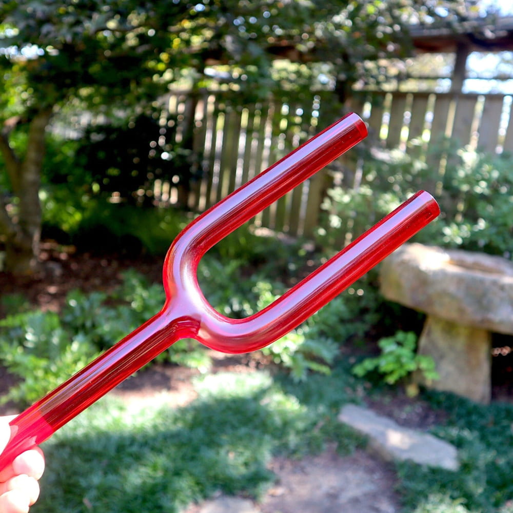 Red plastic tuning fork for 528Hz sound healing and chakra therapy