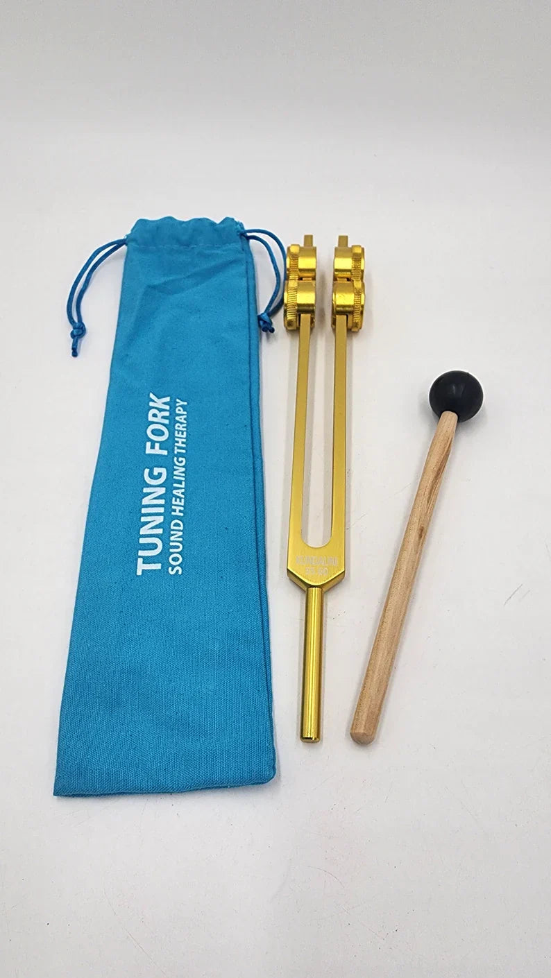 Gold-colored 55.60 Hz Kundalini Weighted Tuning Fork with mallet and blue pouch