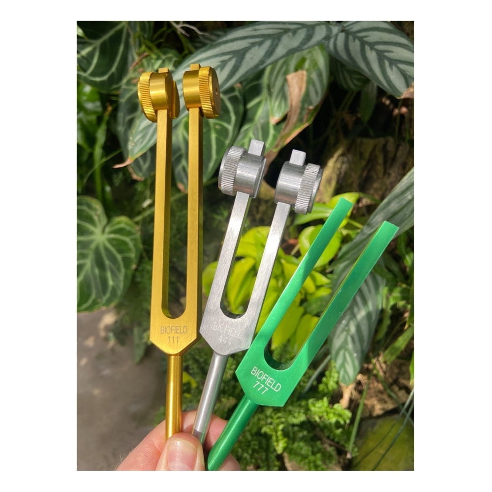 Three tuning forks in gold, silver, and green from 5pc Tuning Fork Set for Healing