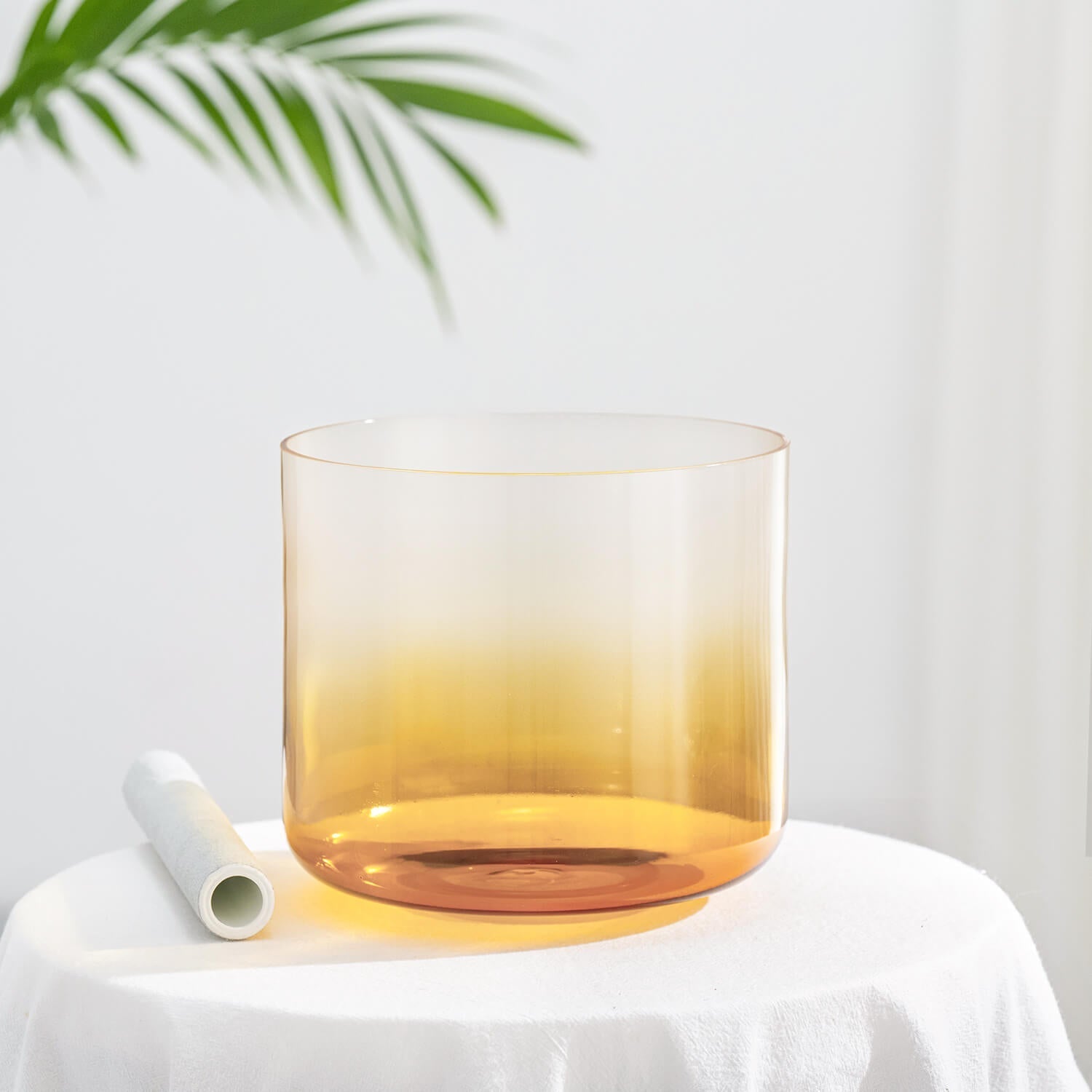 Amber-tinted glass drinking vessel with cylindrical shape for Quartz Crystal Singing Bowl