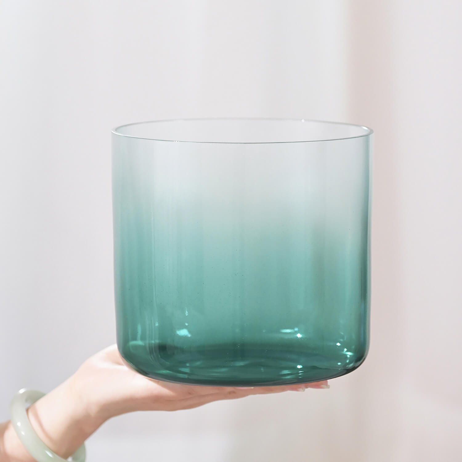 Teal gradient glass tumbler complementing Quartz Crystal Singing Bowl for meditation