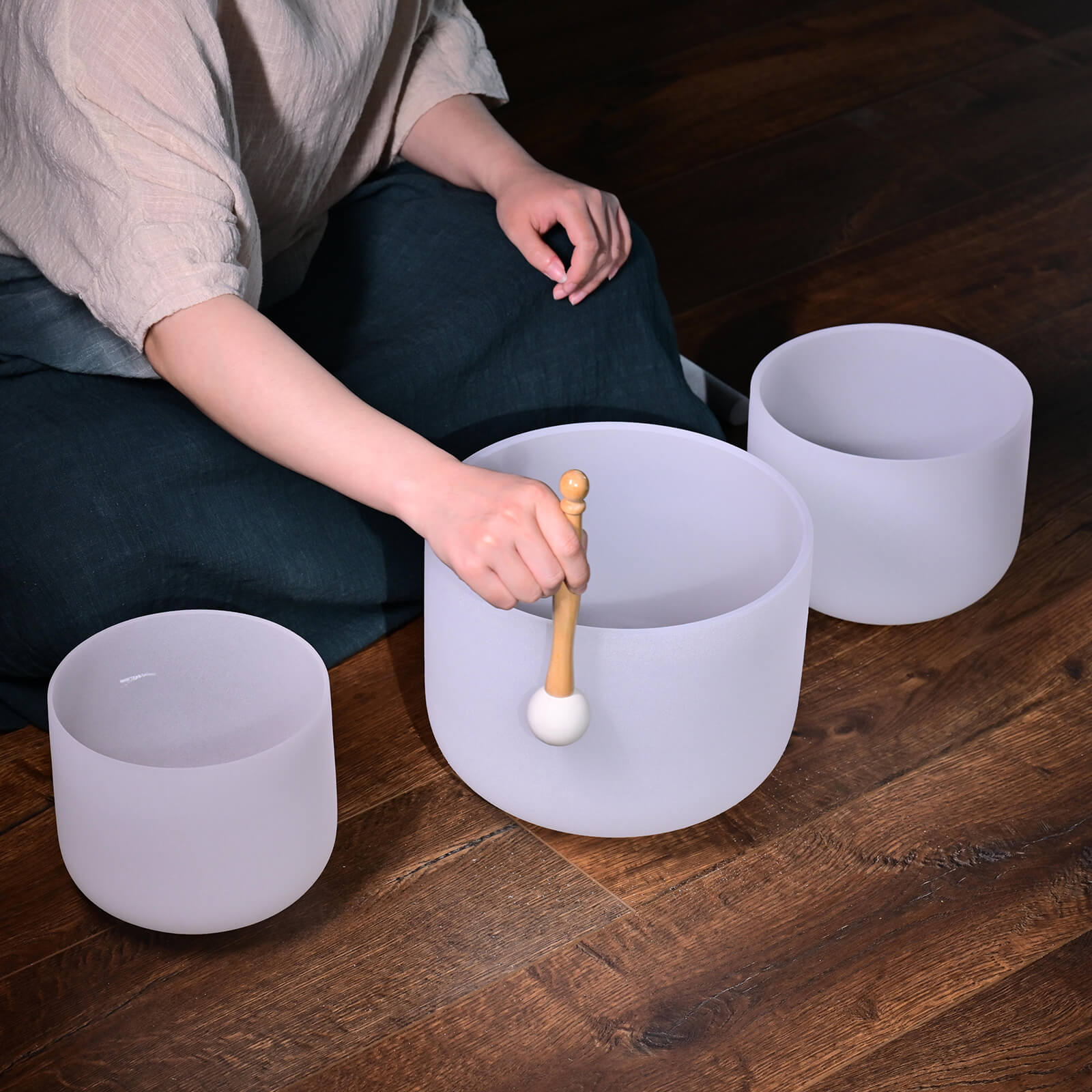 Frosted crystal singing bowls with a mallet from Quartz Crystal Singing Bowl Set