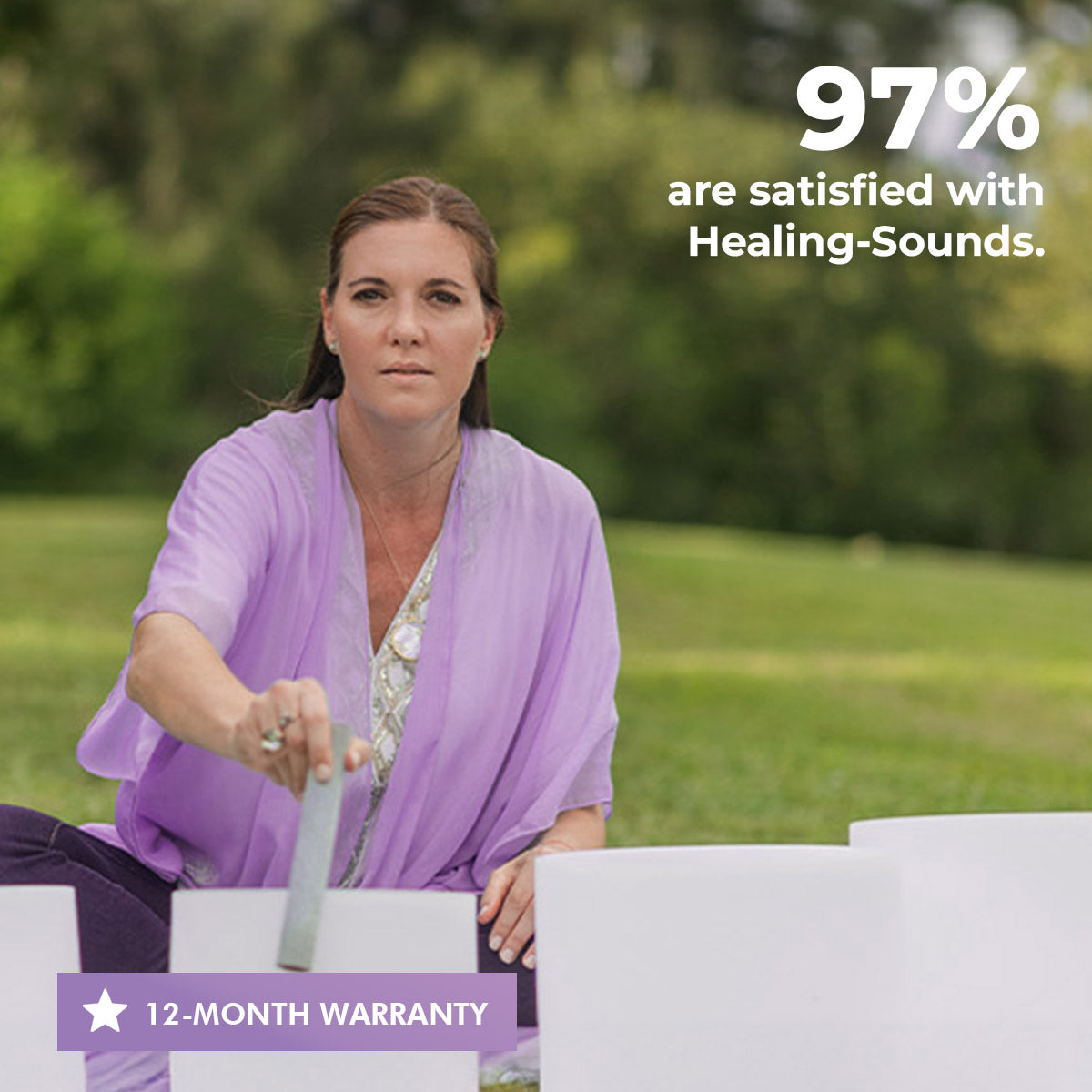 Person in lavender shawl seated outdoors with Quartz Crystal Singing Bowl Set for healing