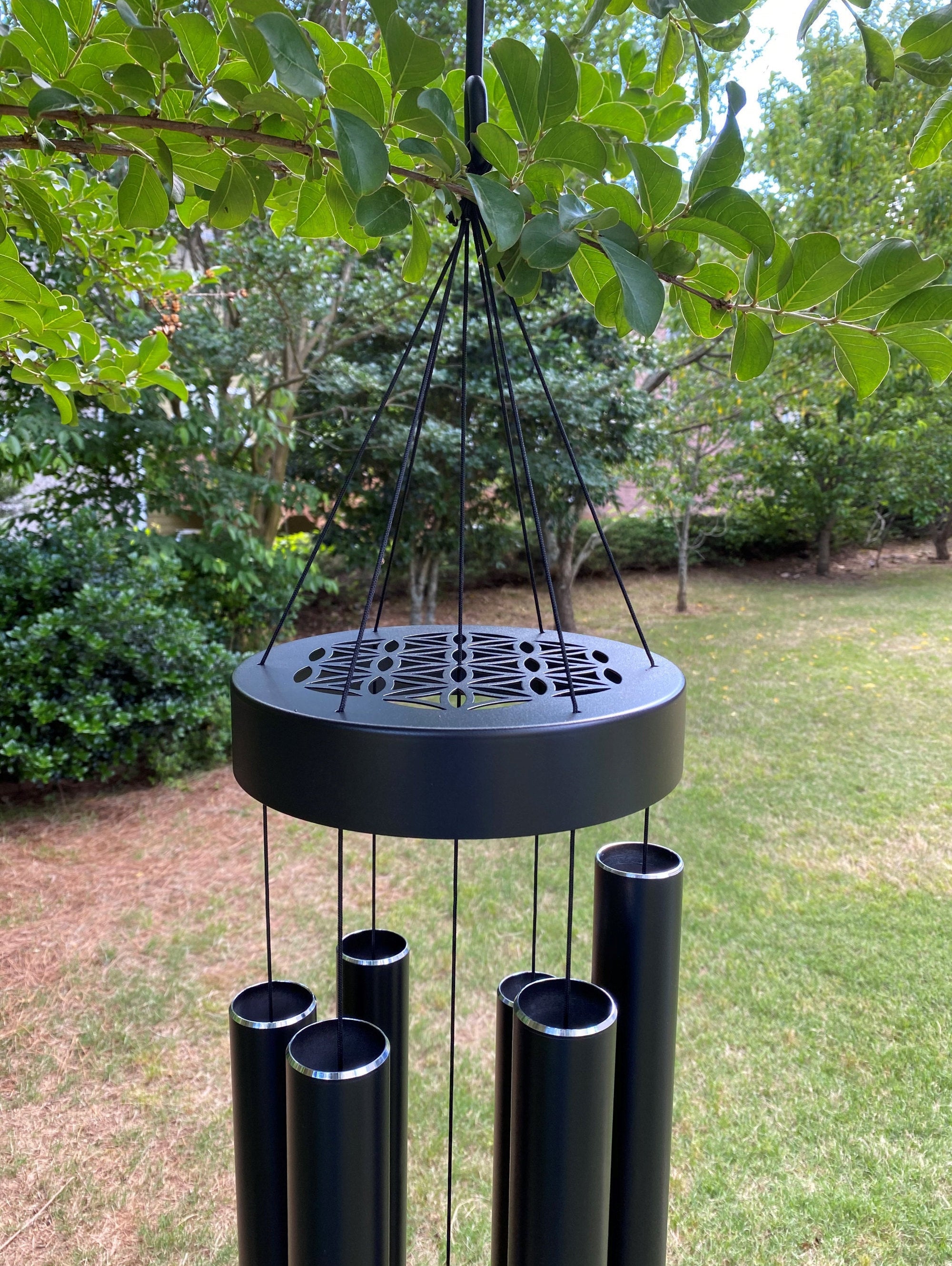 Black wind chimes with cylindrical tubes from the 60 inch Large Deep Tone Black Metal Wind Chime