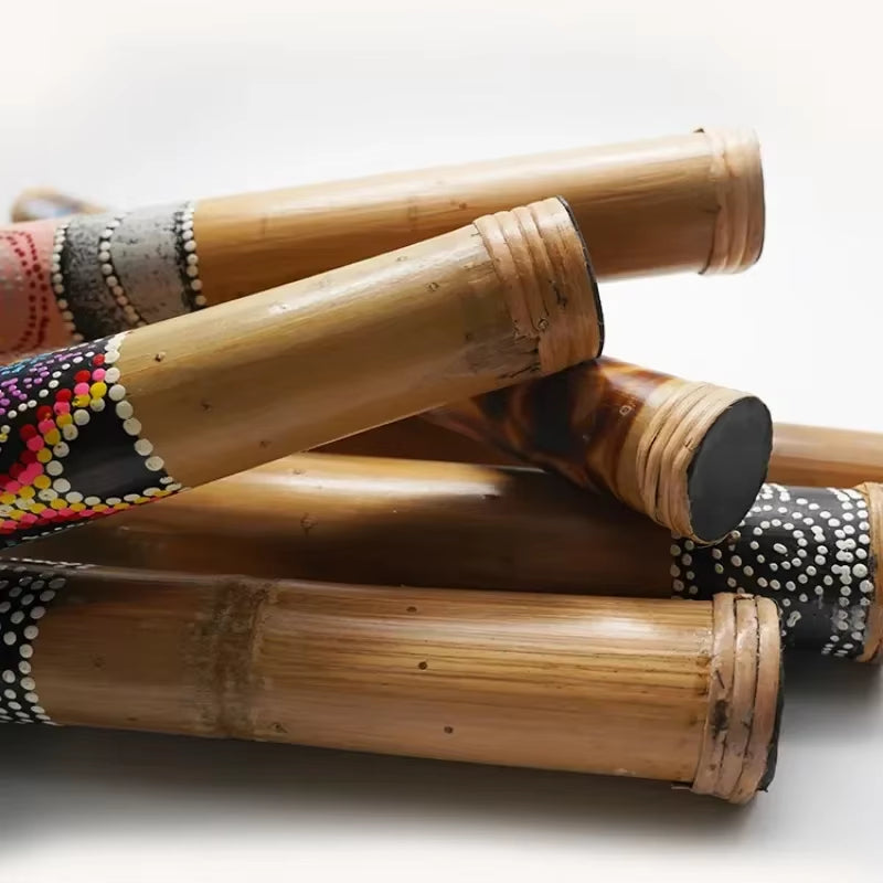 Bamboo rain sticks with colorful bead patterns in various sizes for percussion use