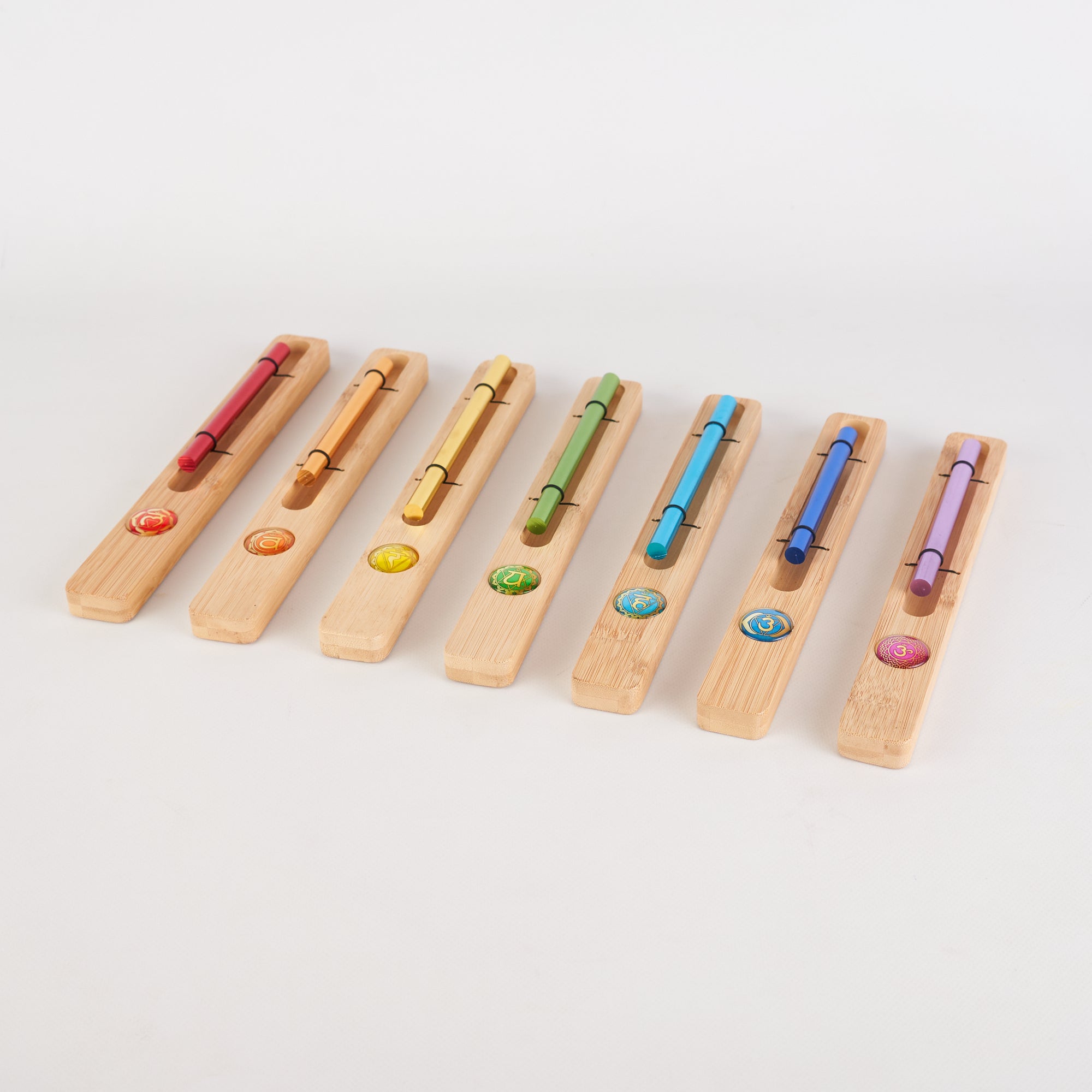 Seven wooden flutes in rainbow order for 7 Chakra Energy Bar Chimes healing