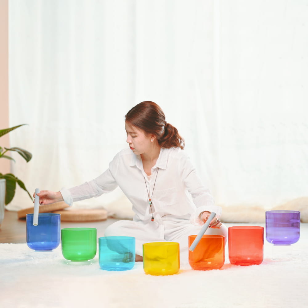 Seven rainbow-colored crystal singing bowls in a 7 PCS Alchemy Clear Color set