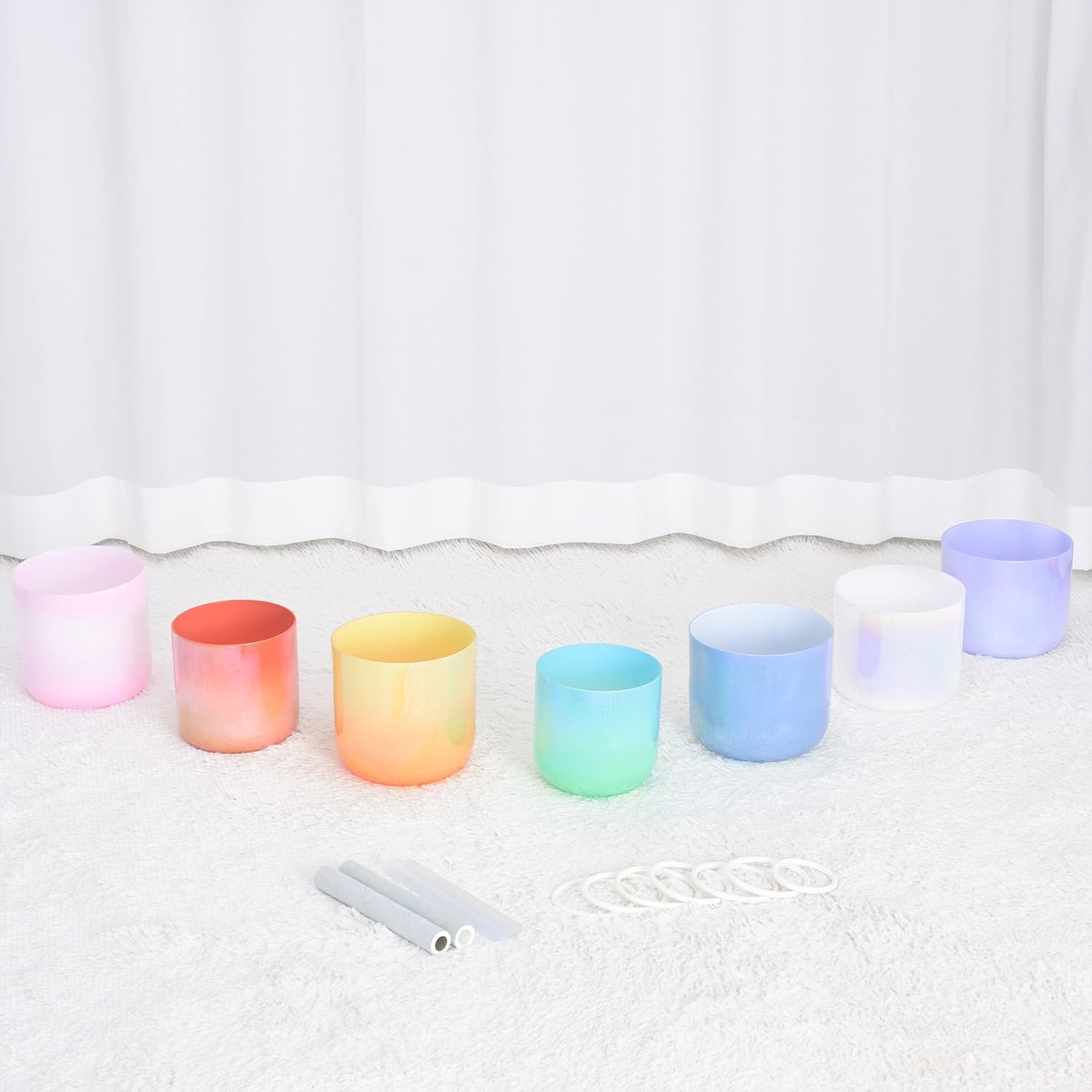 Colorful crystal singing bowls with mallets in a 7 PCS set for sound healing therapy