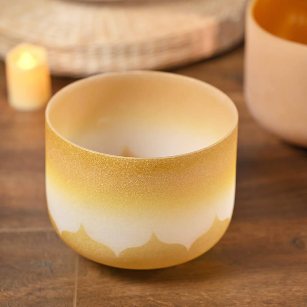 Ceramic bowl featuring a white and golden yellow gradient pattern for Golden Lotus Design