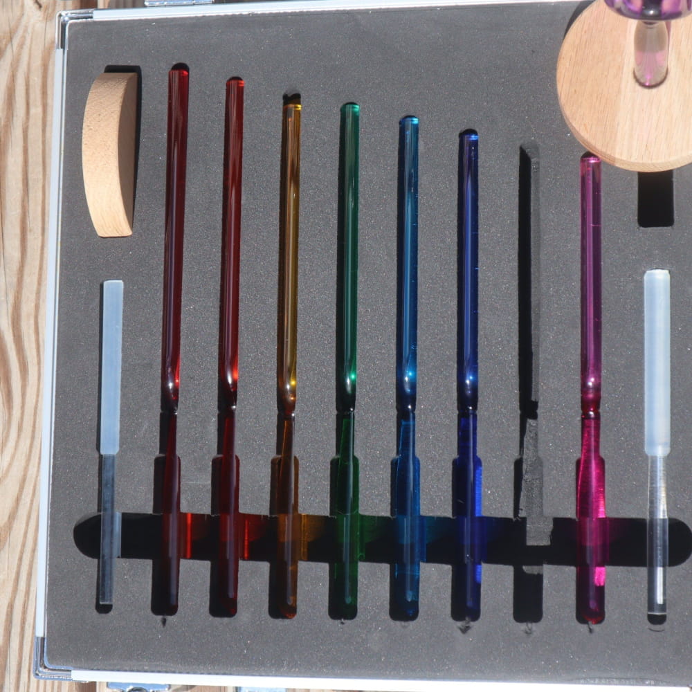 Colorful lightsaber pens arranged in rainbow spectrum for creative expression