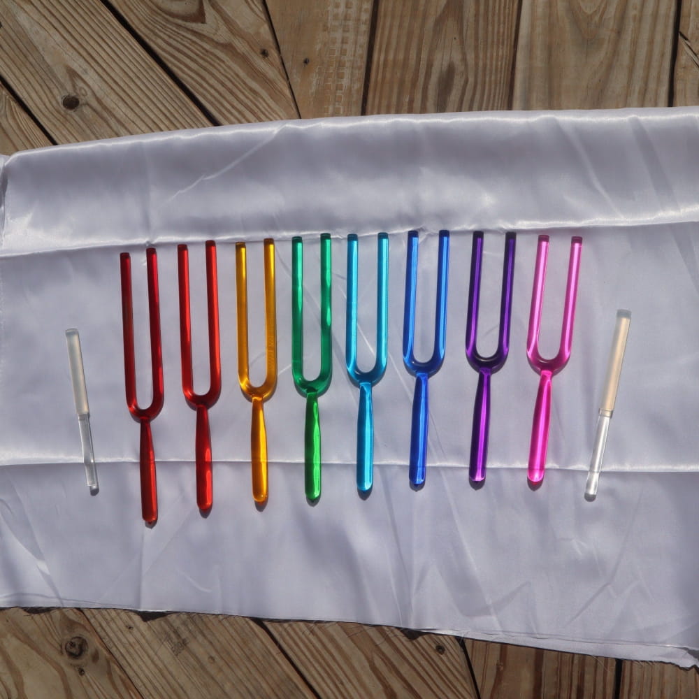 Rainbow-colored tuning forks in a spectrum for the 8pc Crystal Tuning Fork Set