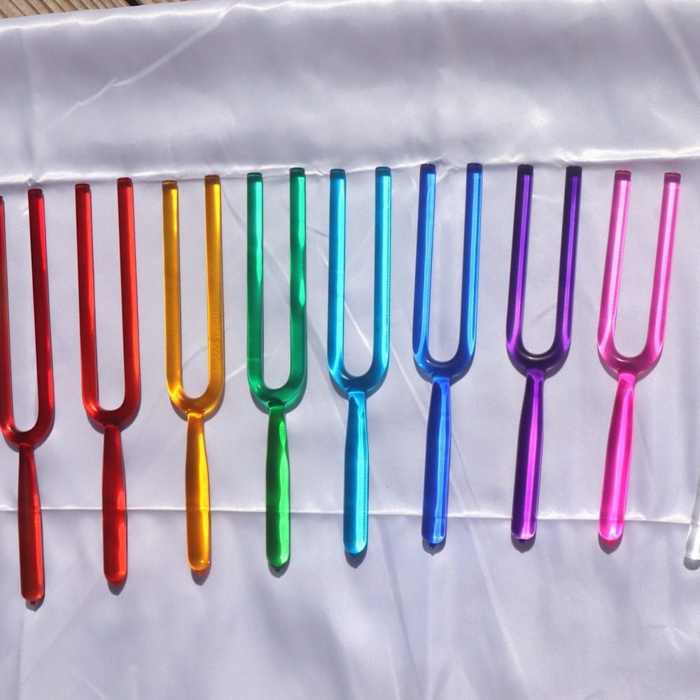 Rainbow-colored tuning forks in a row for 8pc Crystal Tuning Fork Set Sound Healing