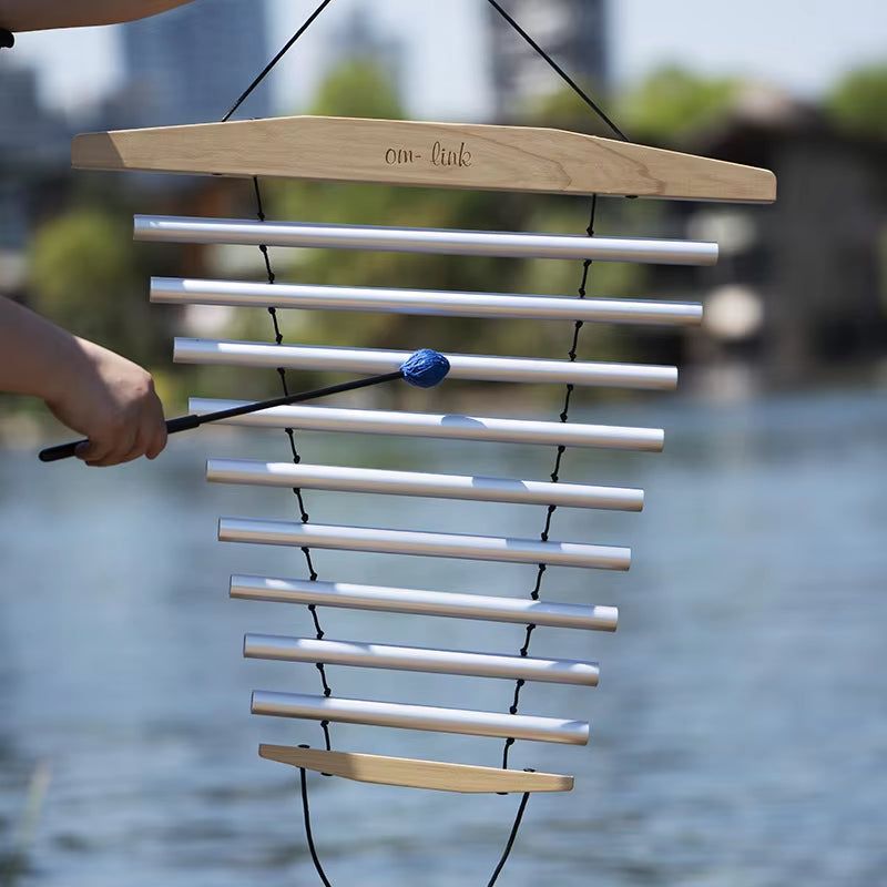 Wind chimes with metal tubes and wooden top for healing and relaxation