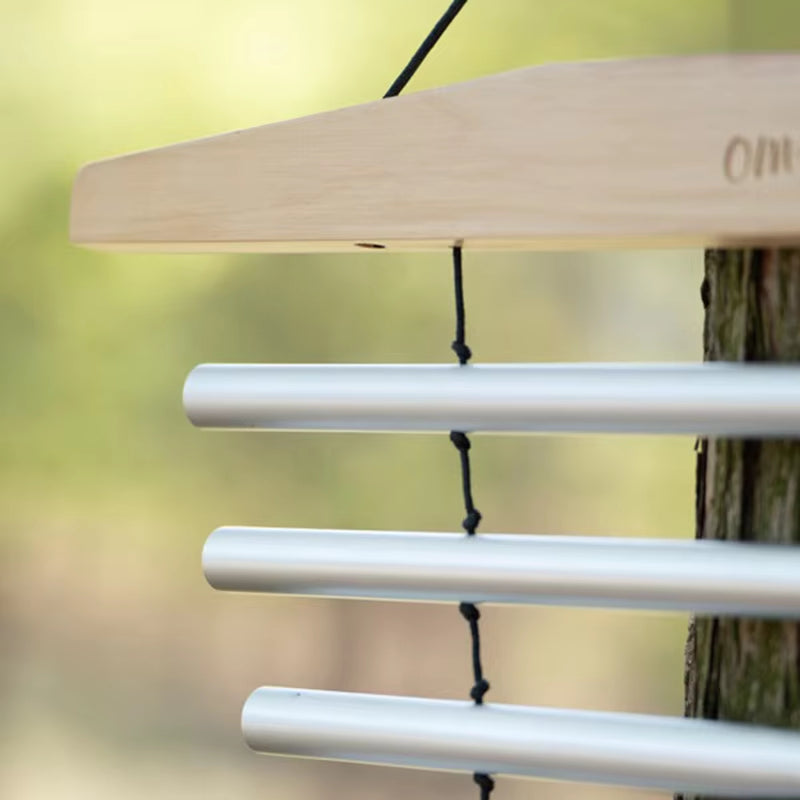 Wind chimes with metallic silver tubes and wooden top for healing and tranquility